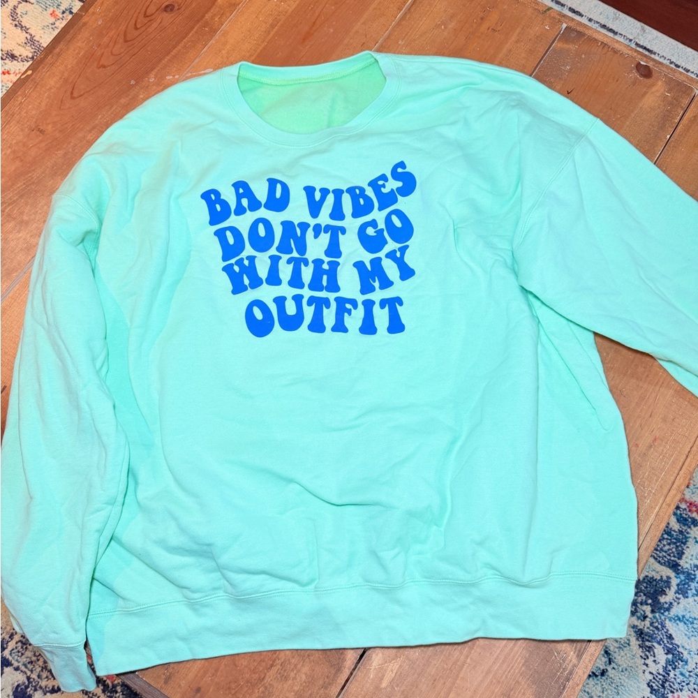 Mint Green Sweatshirt with Blue Text